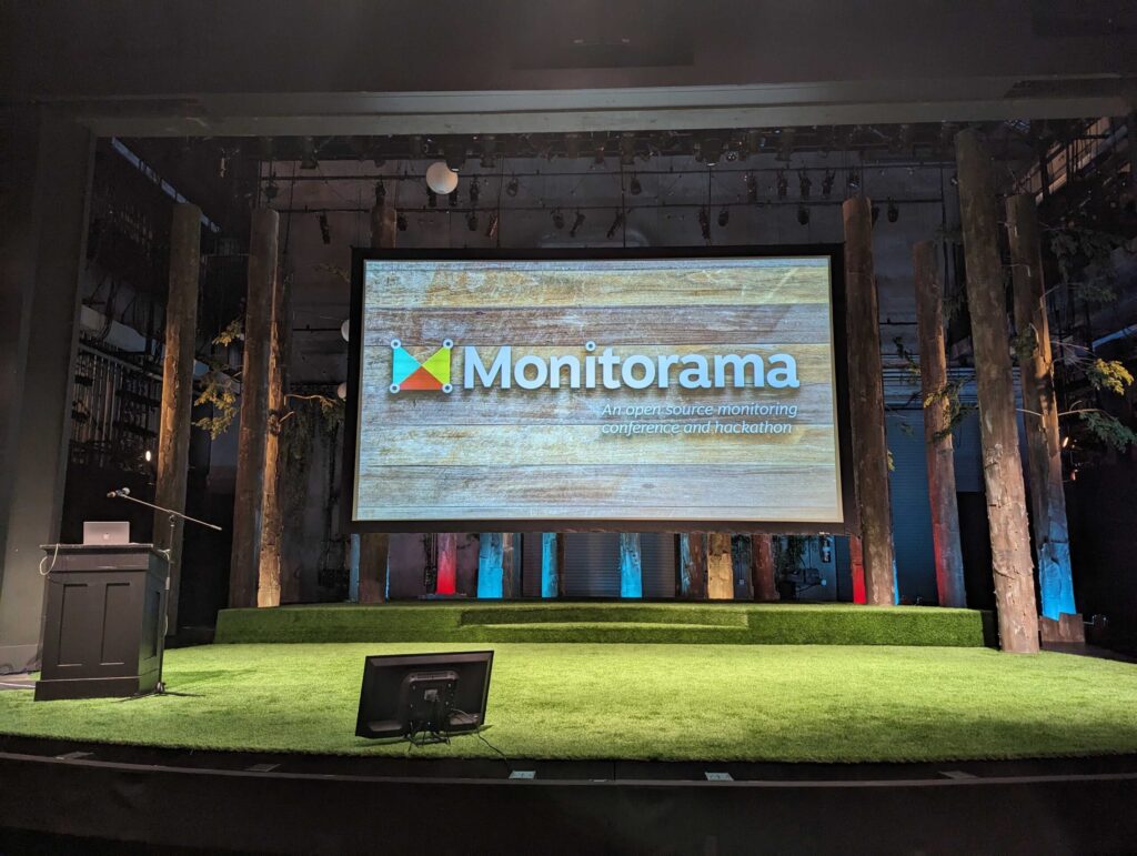 A stage with the word Monitorama displayed.