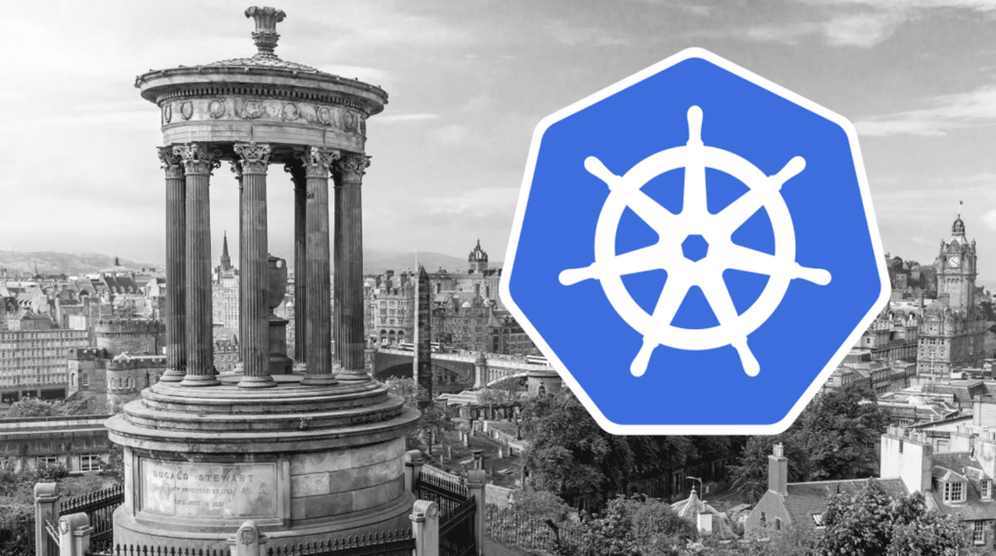 A black and white photo of a city with the Kubernetes logo.