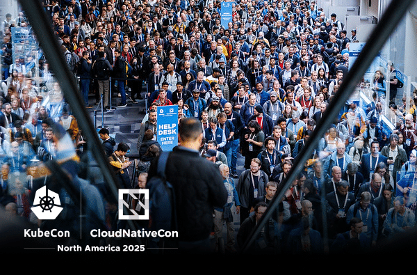 A large crowd gathers in a lobby at KubeCon NA 2025, a leading Kubernetes conference; a help desk sign is visible among attendees at KubeCon + CloudNativeCon North America 2025.